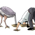 Ostrich & businessman with their heads in the ground