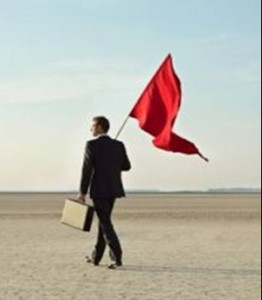 Man in suit with red flag